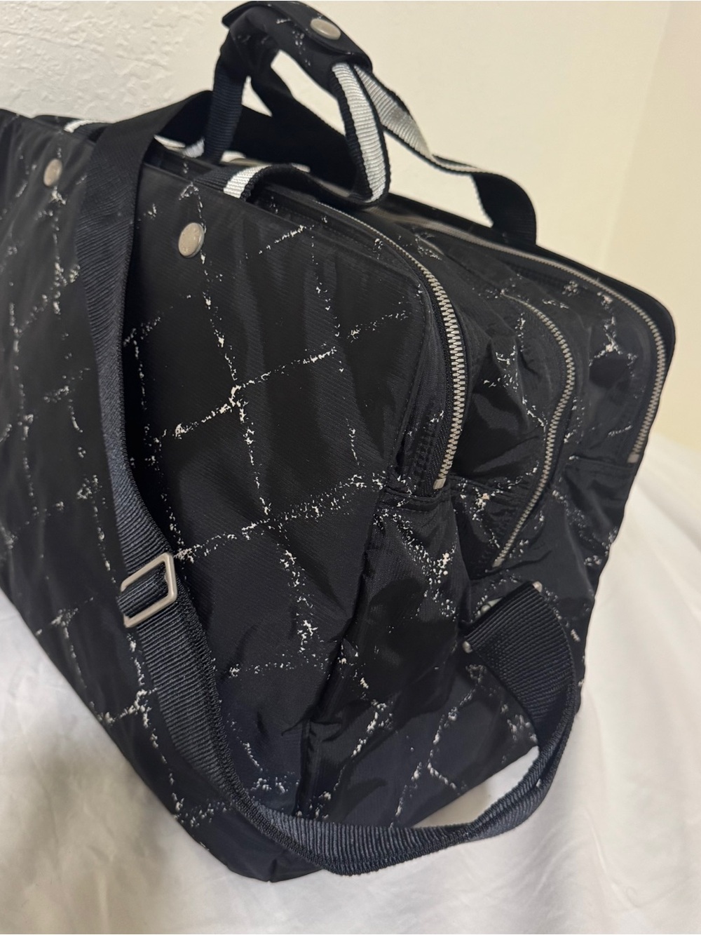 CHANEL Black Quilted Duffel with White Distressed Grid